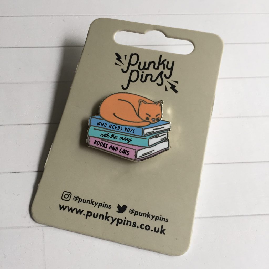 Punky pins books and cat